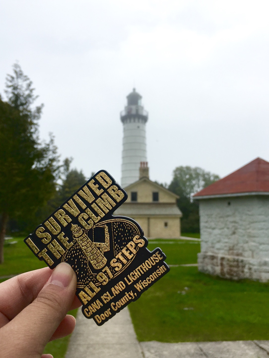 Magnet saying I survived climbing 97 steps with the lighthouse in the background